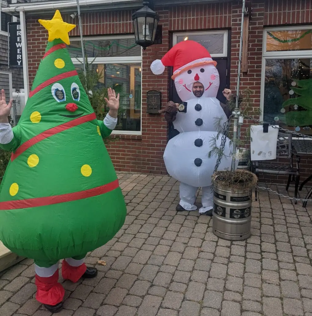 Guests taking photos at Footbridge Brewery Gardens Aglow special event for 0 gift card contest.